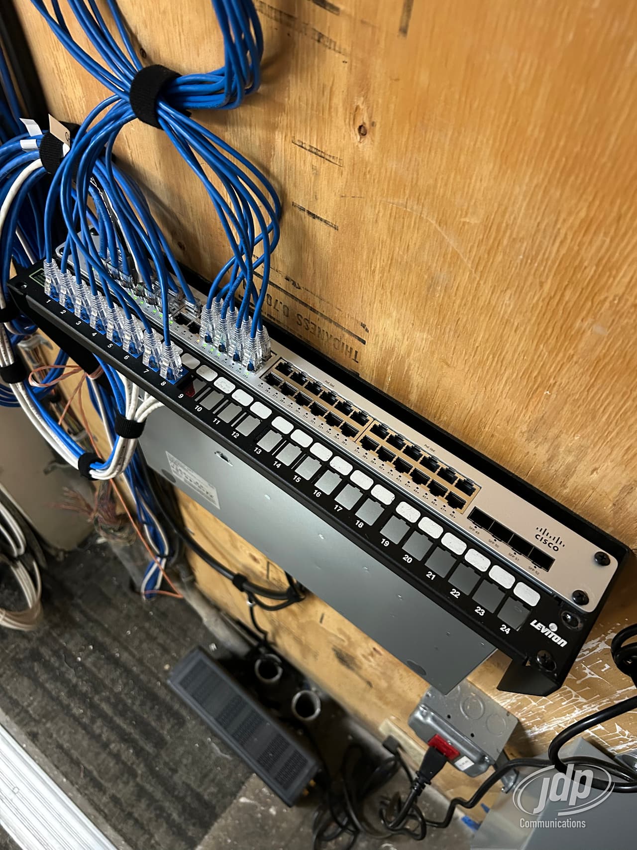 Carrier circuits landed on a backboard-mounted patch panel