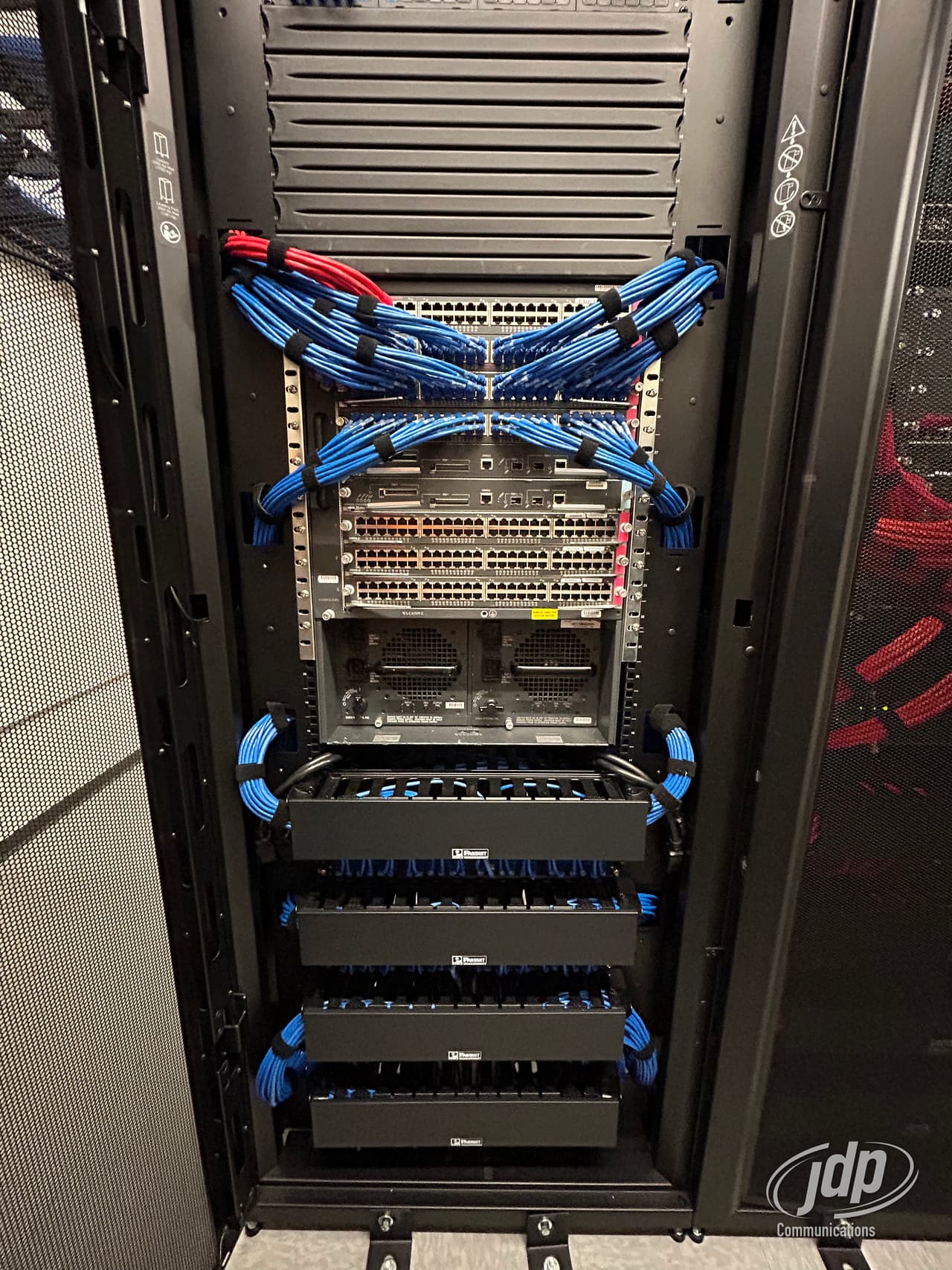 Dressed Cat6 patch cords terminated in a network rack