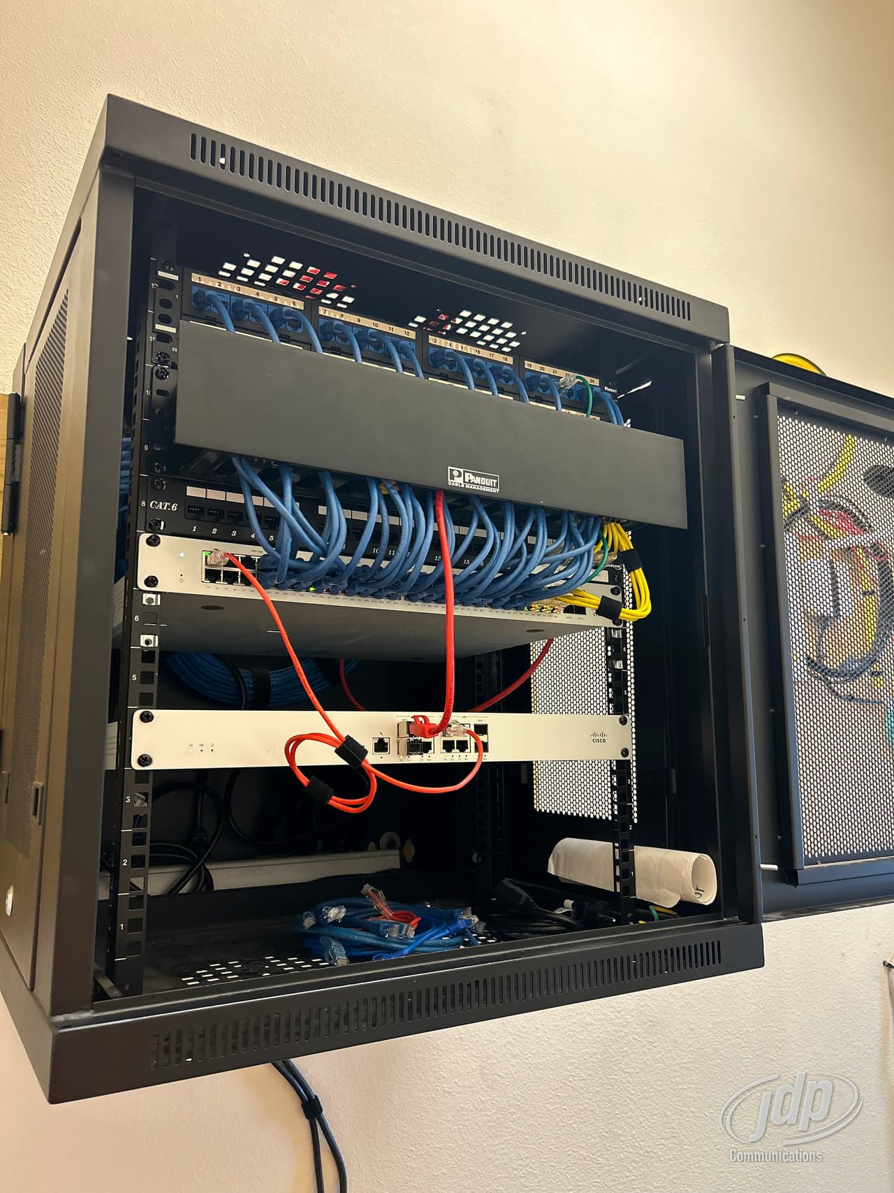 Communications cabinet feeding a commercial office build